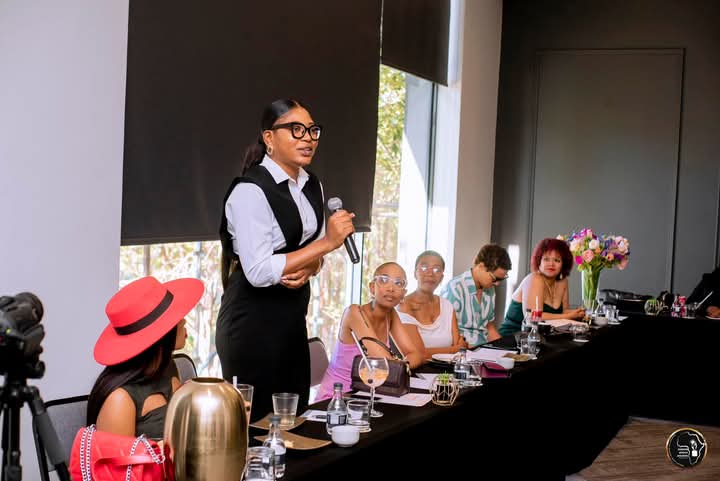 A speaker addressing the room during the SheReign Africa summit